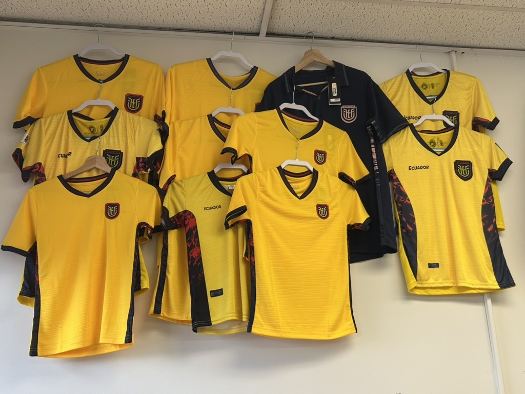 Yellow Ecuador soccer jerseys displayed on the shop wall